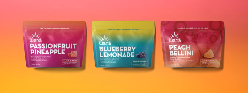 Three pouches of Wana Gummies in a row. The flavors from left to right are: Passionfruit Pineapple, Blueberry Lemonade, and Peach Bellini.